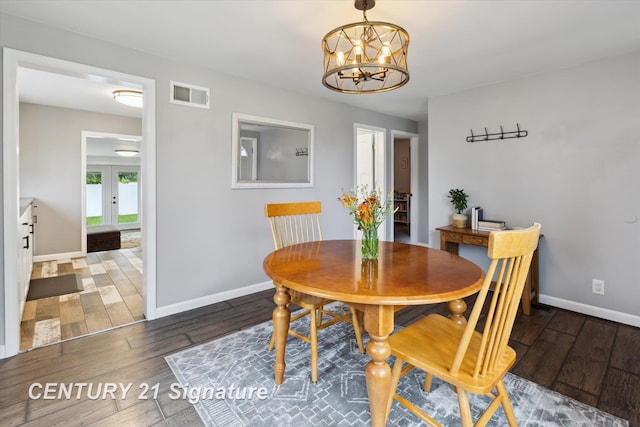 6357 Mackinaw Rd, Saginaw, MI 48604 - dining space with wood finished floors and a chandelier