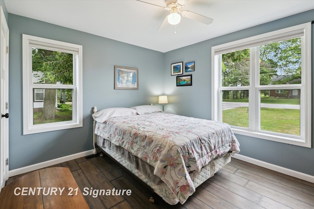 6357 Mackinaw Rd, Saginaw, MI 48604 - bedroom featuring multiple windows, wood-type flooring, and a ceiling fan