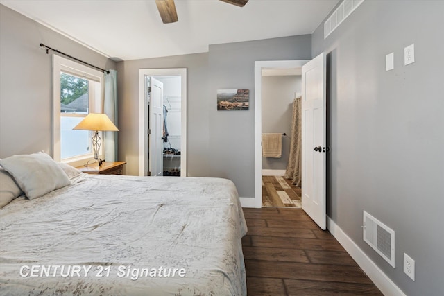 6357 Mackinaw Rd, Saginaw, MI 48604 - bedroom featuring dark wood finished floors, a walk in closet, a closet, and a ceiling fan
