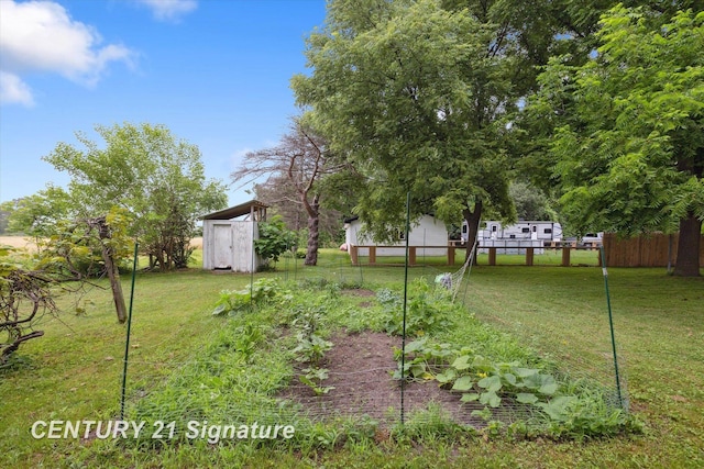 6357 Mackinaw Rd, Saginaw, MI 48604 - view of yard featuring a storage shed and a garden