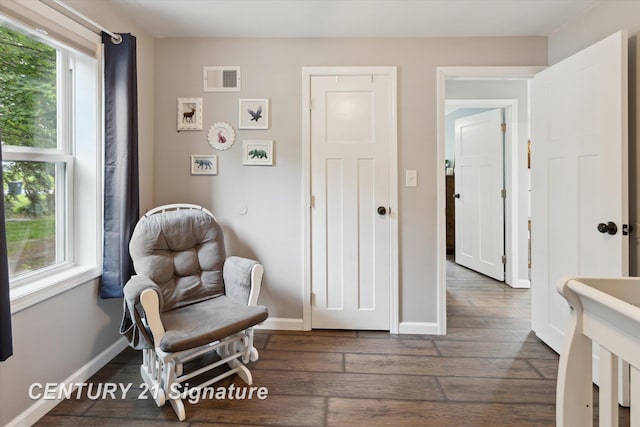 6357 Mackinaw Rd, Saginaw, MI 48604 - sitting room featuring dark wood finished floors and baseboards