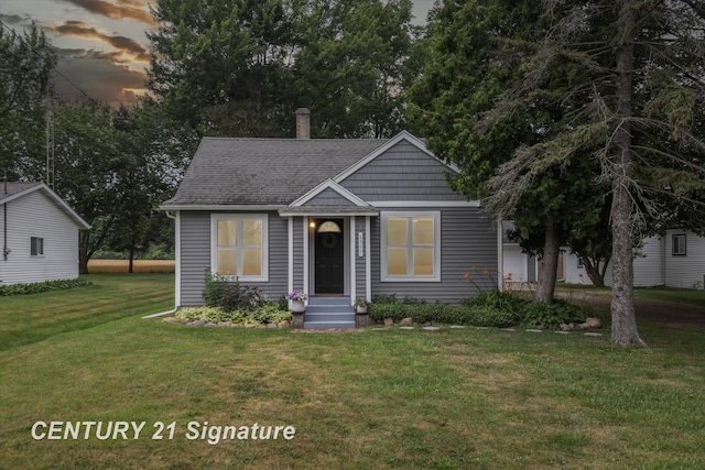 6357 Mackinaw Rd, Saginaw, MI 48604 - bungalow featuring a lawn, a chimney, and a shingled roof