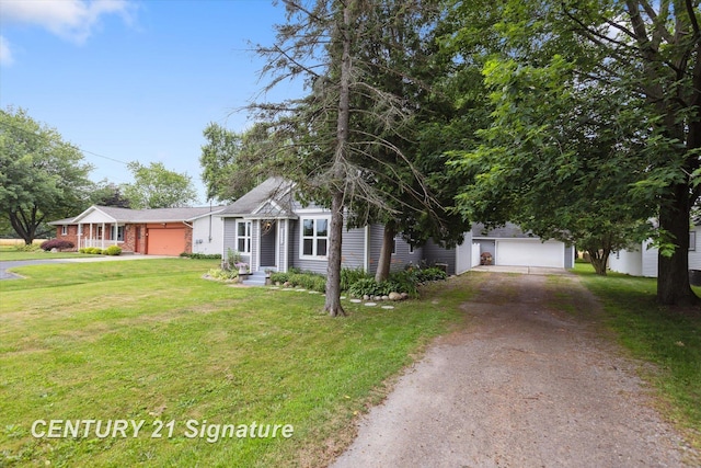 6357 Mackinaw Rd, Saginaw, MI 48604 - view of front of house featuring dirt driveway, an attached garage, a front yard, and brick siding