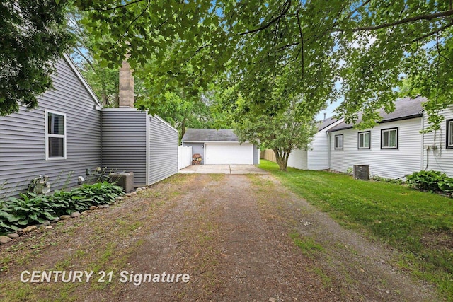 6357 Mackinaw Rd, Saginaw, MI 48604 - view of yard featuring an outdoor structure and dirt driveway