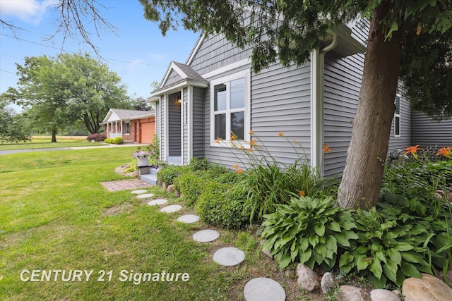 6357 Mackinaw Rd, Saginaw, MI 48604 - view of home's exterior with a yard