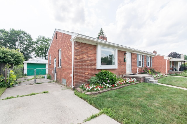 11015 Fairfield St, Livonia, MI 48150 - ranch-style home featuring brick siding, a gate, a chimney, and a garage