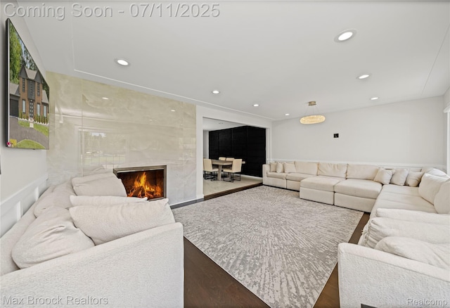 5534 Apple Ridge Trl, West Bloomfield, MI 48322 - living room featuring a premium fireplace, recessed lighting, and wood finished floors