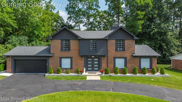 5534 Apple Ridge Trl, West Bloomfield, MI 48322 - view of front of house featuring a front lawn, roof with shingles, and brick siding