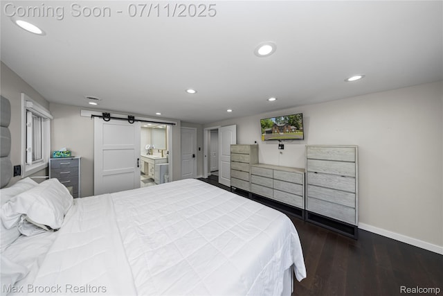 5534 Apple Ridge Trl, West Bloomfield, MI 48322 - bedroom featuring a barn door, dark wood finished floors, recessed lighting, and connected bathroom