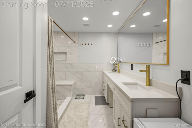 5534 Apple Ridge Trl, West Bloomfield, MI 48322 - bathroom featuring recessed lighting, double vanity, a tile shower, and marble finish flooring