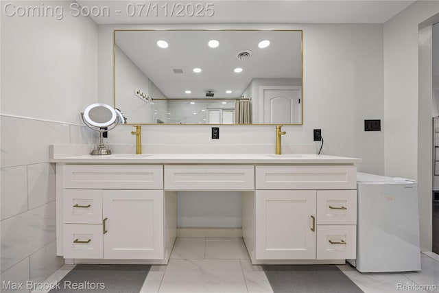 5534 Apple Ridge Trl, West Bloomfield, MI 48322 - full bathroom featuring a walk in shower, recessed lighting, double vanity, and marble look tiles