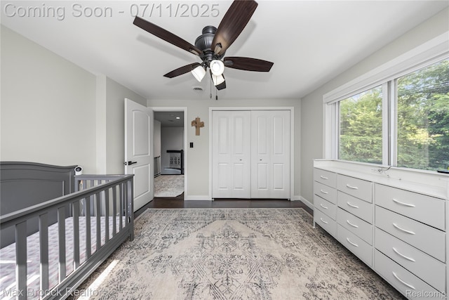 5534 Apple Ridge Trl, West Bloomfield, MI 48322 - unfurnished bedroom with wood finished floors, a closet, a ceiling fan, and a crib