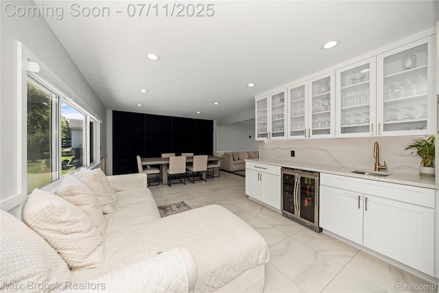 5534 Apple Ridge Trl, West Bloomfield, MI 48322 - living room featuring wine cooler, recessed lighting, light marble finish floors, and bar