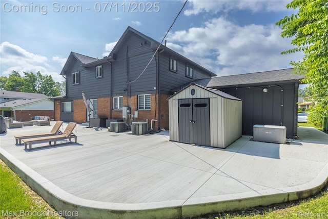 5534 Apple Ridge Trl, West Bloomfield, MI 48322 - back of house featuring a storage shed, brick siding, a wooden deck, and board and batten siding