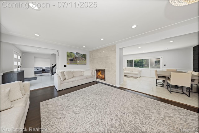 5534 Apple Ridge Trl, West Bloomfield, MI 48322 - living area with recessed lighting, healthy amount of natural light, a fireplace, and wood finished floors