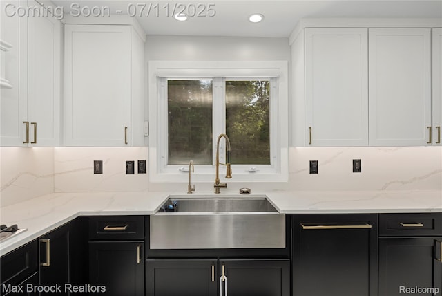 5534 Apple Ridge Trl, West Bloomfield, MI 48322 - kitchen with white cabinets, dark cabinets, backsplash, light stone counters, and recessed lighting