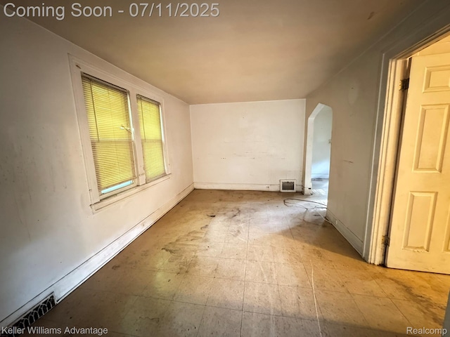 285 Voorheis St, Pontiac, MI 48341 - empty room featuring arched walkways and baseboards
