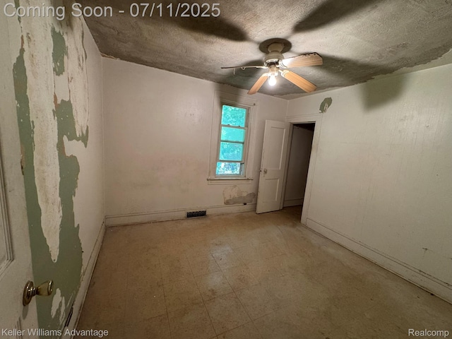 285 Voorheis St, Pontiac, MI 48341 - spare room with a ceiling fan, a textured ceiling, and tile patterned floors