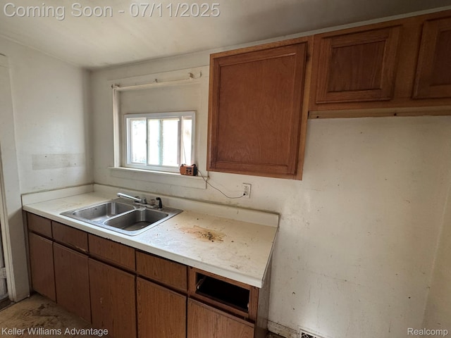 285 Voorheis St, Pontiac, MI 48341 - kitchen featuring light countertops and brown cabinetry