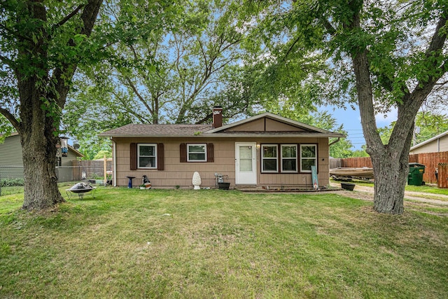2416 S 16th, Niles, MI 49120 - view of front of house with an outdoor fire pit, a chimney, and a shingled roof
