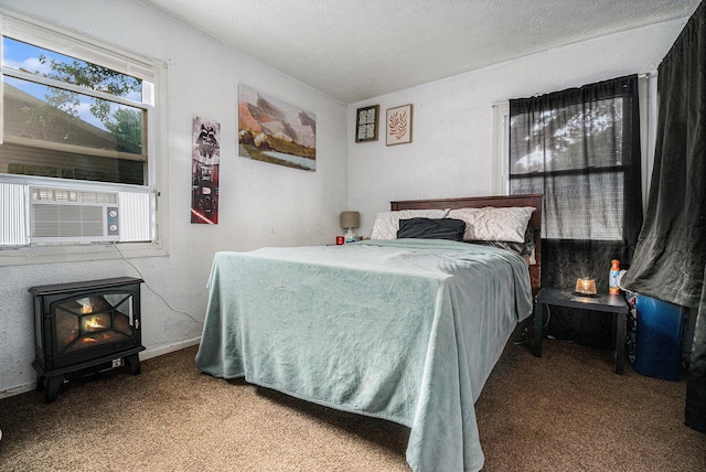 2416 S 16th, Niles, MI 49120 - bedroom featuring a wood stove, carpet floors, cooling unit, and a textured ceiling