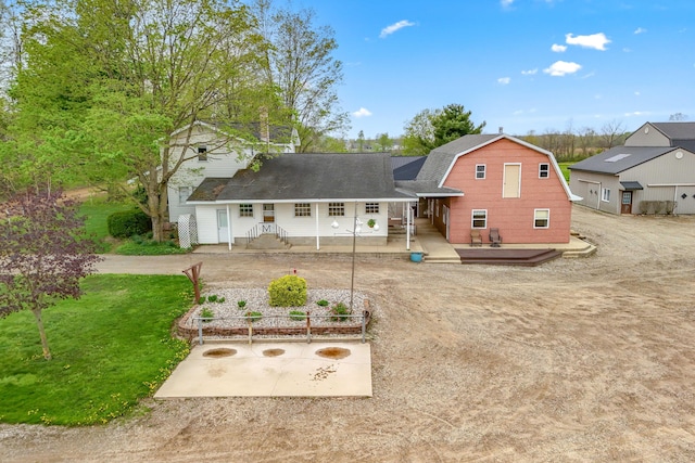 810 Newton Rd, Coldwater, MI 49036 - back of property with a gambrel roof, a wooden deck, and a shingled roof