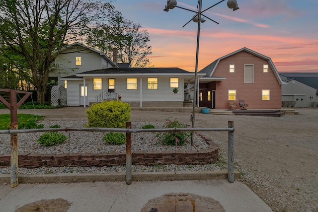 810 Newton Rd, Coldwater, MI 49036 - view of front of house featuring a fenced front yard and a gambrel roof