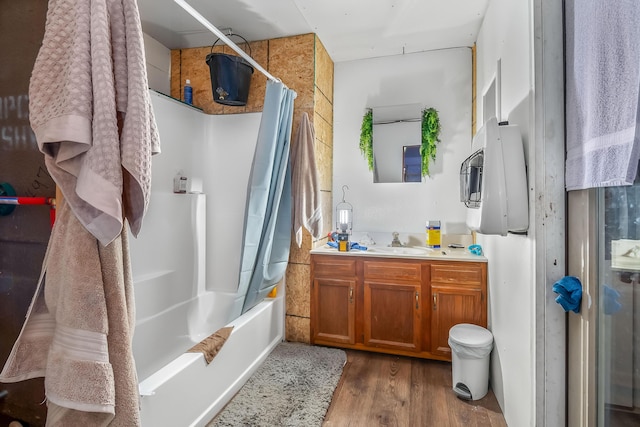 810 Newton Rd, Coldwater, MI 49036 - bathroom with vanity, wood finished floors, and shower / bath combo with shower curtain