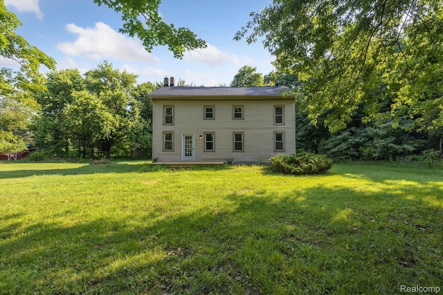 11240 Silver Lake Rd, Byron, MI 48418 - back of house featuring a yard and a chimney