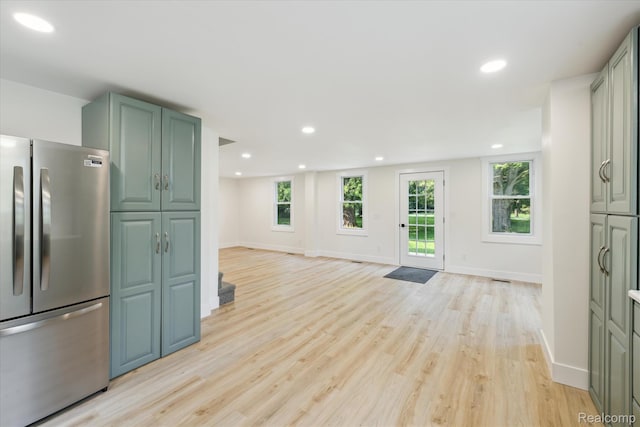 11240 Silver Lake Rd, Byron, MI 48418 - kitchen featuring freestanding refrigerator, light wood-style floors, recessed lighting, open floor plan, and green cabinets