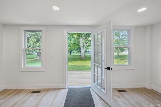 11240 Silver Lake Rd, Byron, MI 48418 - entryway featuring plenty of natural light, light wood-type flooring, recessed lighting, and french doors