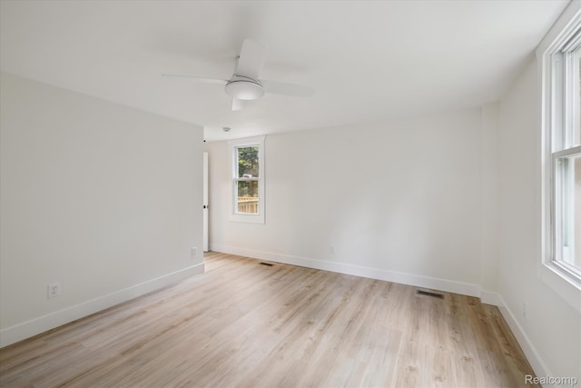 11240 Silver Lake Rd, Byron, MI 48418 - spare room featuring light wood-style floors and a ceiling fan