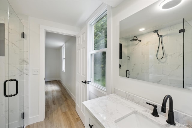 11240 Silver Lake Rd, Byron, MI 48418 - full bath with a marble finish shower, vanity, and wood finished floors
