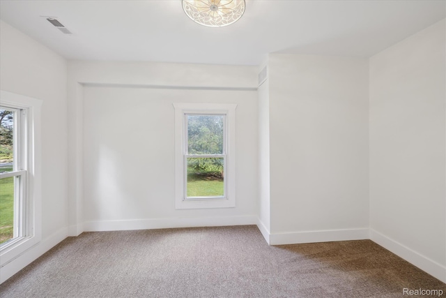 11240 Silver Lake Rd, Byron, MI 48418 - carpeted empty room featuring plenty of natural light
