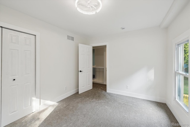11240 Silver Lake Rd, Byron, MI 48418 - unfurnished bedroom featuring carpet floors and a closet