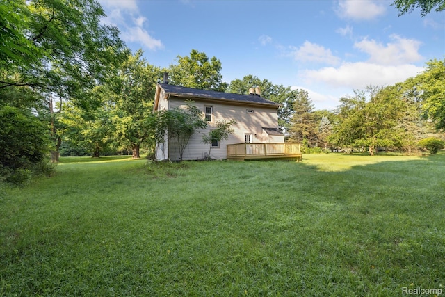 11240 Silver Lake Rd, Byron, MI 48418 - view of green lawn with a deck