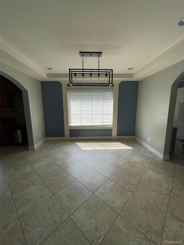 23364 Clark Rd, Belleville, MI 48111 - empty room with arched walkways and light tile patterned floors