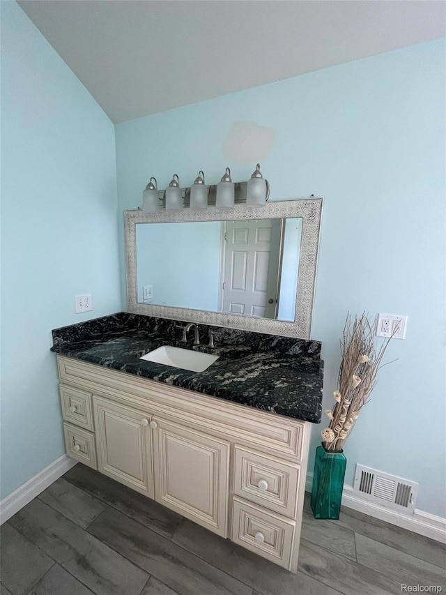 23364 Clark Rd, Belleville, MI 48111 - bathroom with wood finished floors and vanity