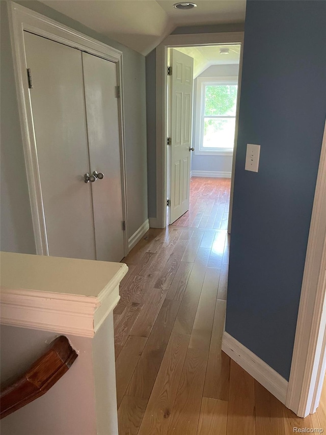 23364 Clark Rd, Belleville, MI 48111 - corridor with hardwood / wood-style flooring and vaulted ceiling