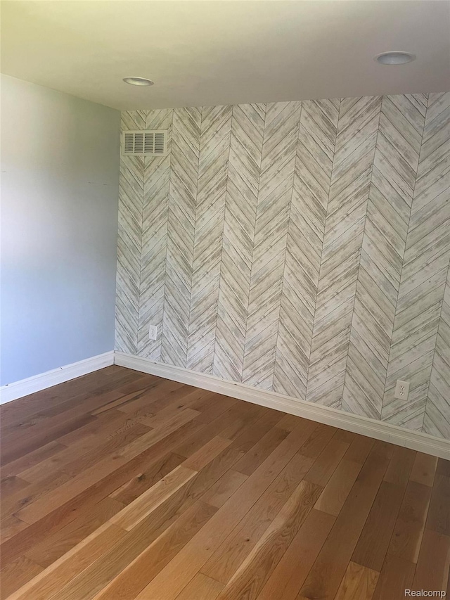 23364 Clark Rd, Belleville, MI 48111 - spare room with hardwood / wood-style floors and baseboards