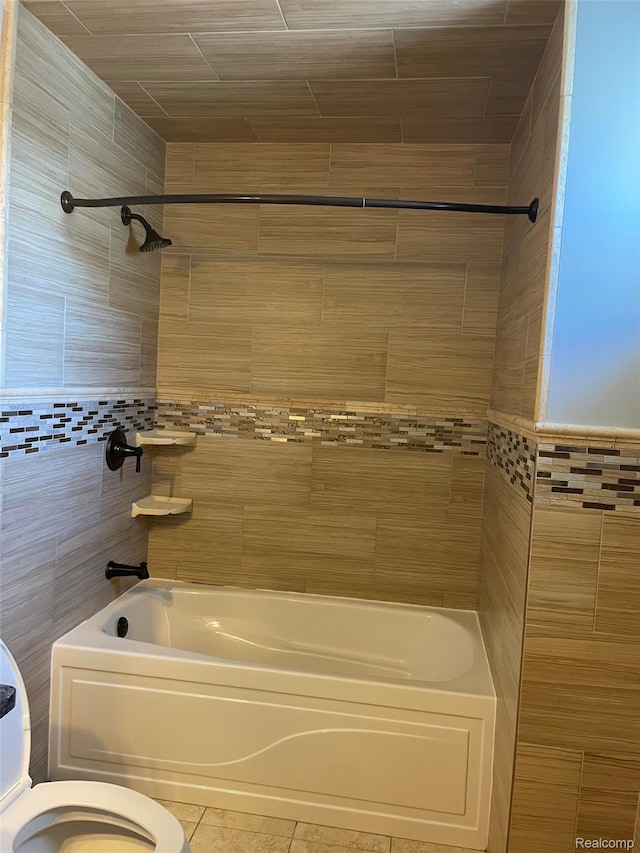 23364 Clark Rd, Belleville, MI 48111 - bathroom with washtub / shower combination, tile patterned floors, and tile walls