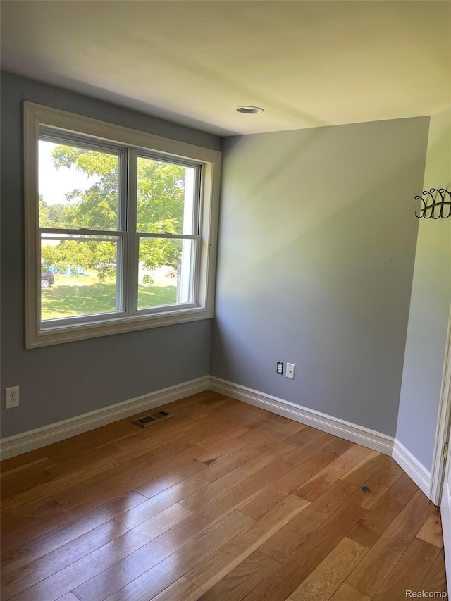 23364 Clark Rd, Belleville, MI 48111 - spare room featuring wood-type flooring and baseboards