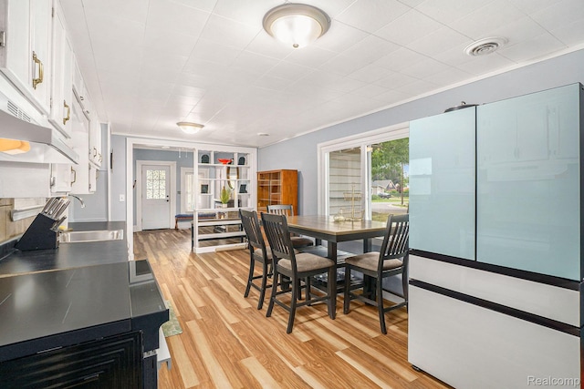 124 N Line St, Chesaning, MI 48616 - dining room featuring light wood-style floors