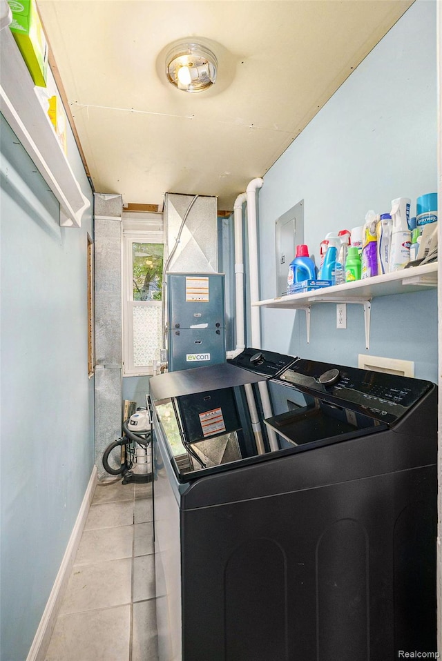 124 N Line St, Chesaning, MI 48616 - laundry area featuring washer and dryer and tile patterned flooring
