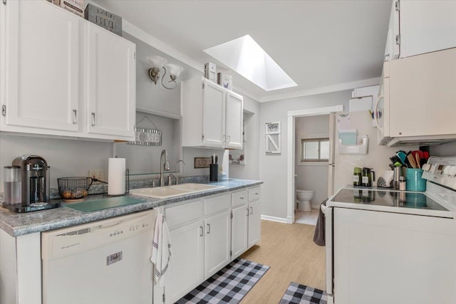 34066 Orangelawn St, Livonia, MI 48150 - kitchen with white appliances, a skylight, white cabinets, light wood-style flooring, and light countertops
