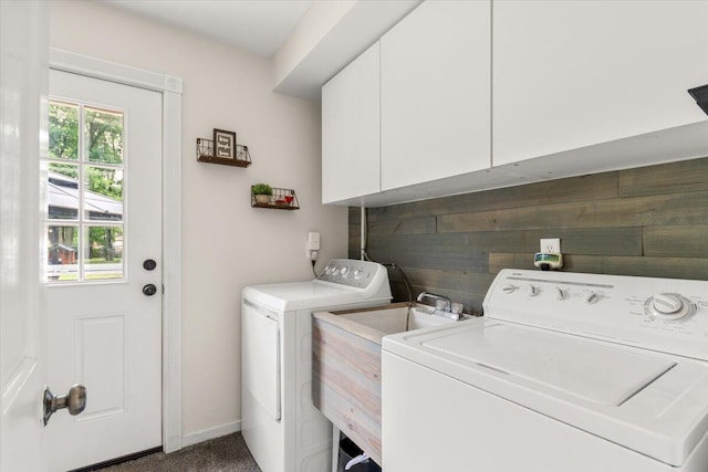 34066 Orangelawn St, Livonia, MI 48150 - laundry room featuring washer and clothes dryer, cabinet space, and wooden walls