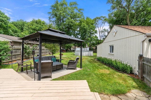 34066 Orangelawn St, Livonia, MI 48150 - wooden deck with a gazebo and an outdoor hangout area