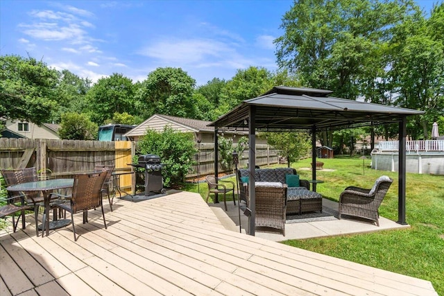 34066 Orangelawn St, Livonia, MI 48150 - wooden terrace featuring a gazebo, a fenced backyard, outdoor lounge area, a grill, and outdoor dining space