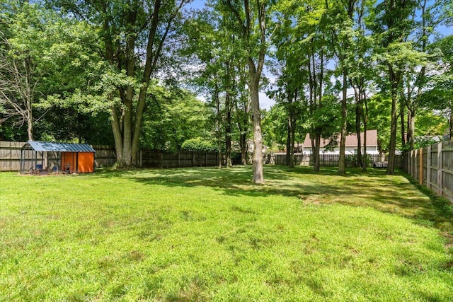 34066 Orangelawn St, Livonia, MI 48150 - fenced backyard featuring a storage shed