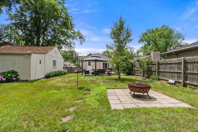 34066 Orangelawn St, Livonia, MI 48150 - fenced backyard featuring a gazebo, a patio, and an outdoor living space with a fire pit
